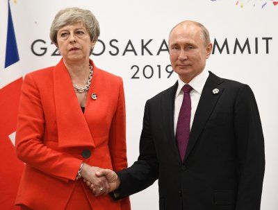 Путин и Мей се срещнаха на форума на Г-20