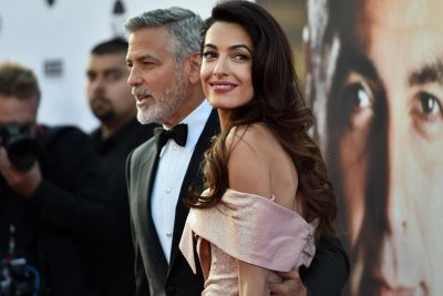 Джордж Клуни кръщава кралското бебе?